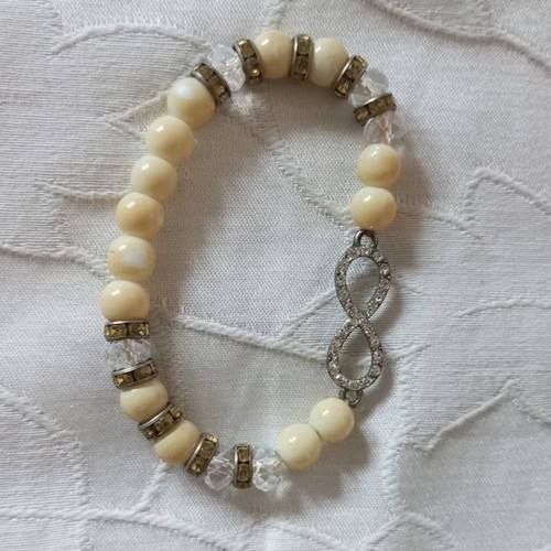 Bracelet with beads and infinity symbol new, cream and silver