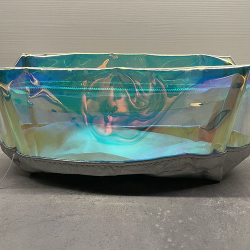 Nuxe holographic makeup bag with silver base