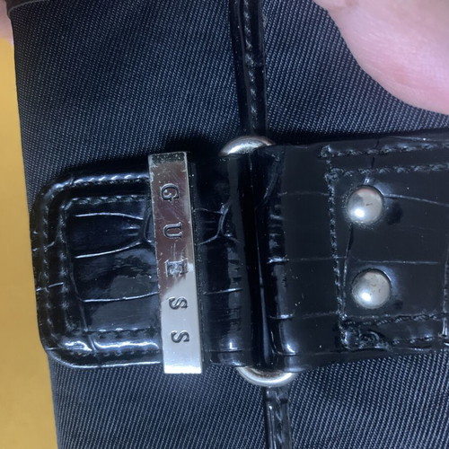 Guess wallet used, black canvas with faux croc details