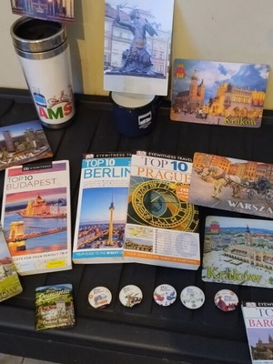 Travel memorabilia collection like new with books, magnets, cup, thermos, postcards, map