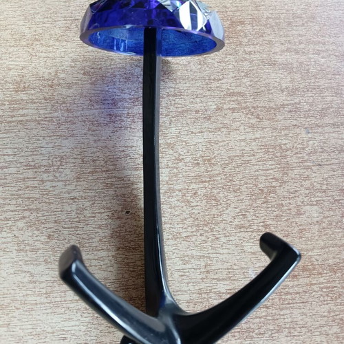 Decorative blue hook with glass-like plastic and metal base