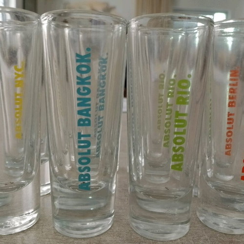 Collectible Absolut shot glasses with city names, like new