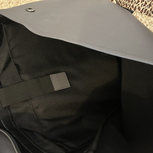 Rains backpack men's used with front wear, gray