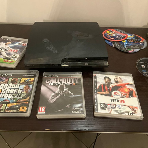 PS3 Slim console with 13 games and Spartan Gear wireless controller