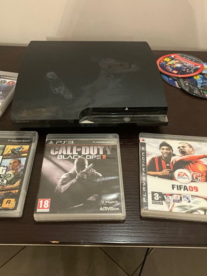 PS3 Slim console with 13 games and Spartan Gear wireless controller
