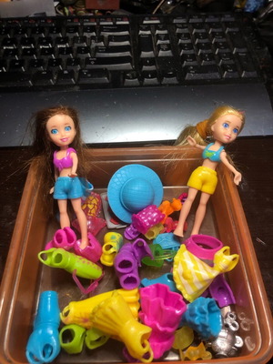Poly Pocket with dresses and accessories like new, two pieces