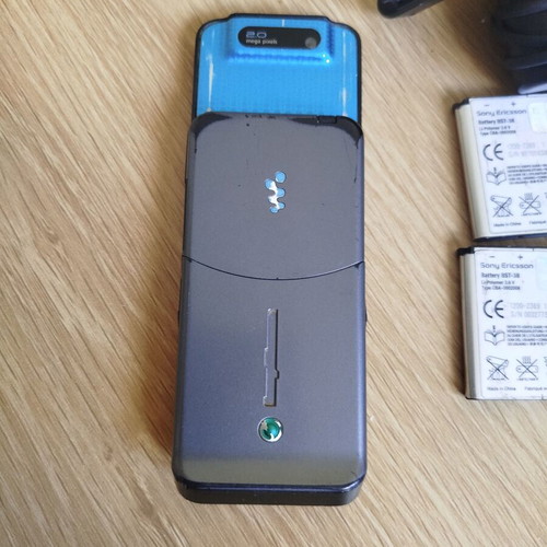 Sony Ericsson w580i used for parts with charger, headphones, and batteries