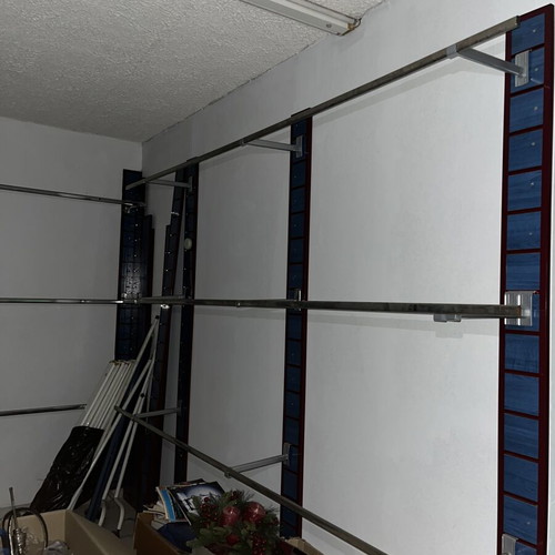 Professional Wall-Mounted Clothing Hanging System like new
