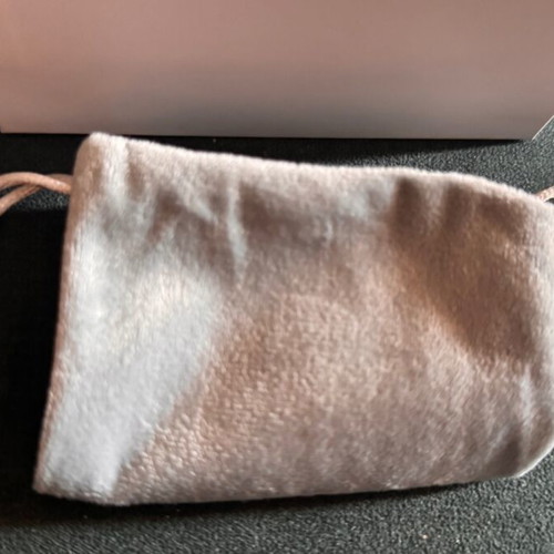 Digital camera used with velvet case, cable, battery, and strap