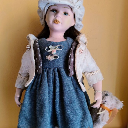 Porcelain doll with stand, 42 cm