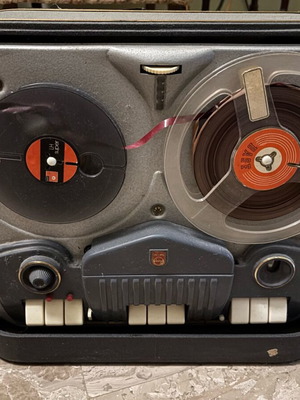 Reel-to-reel tape recorder used with case
