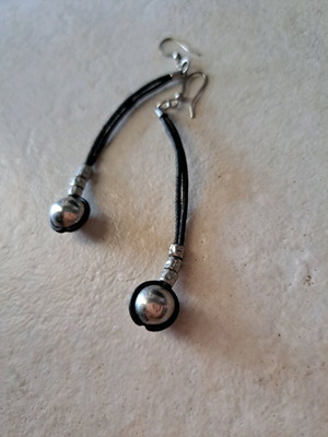 Long earrings used with leather cord and silver details
