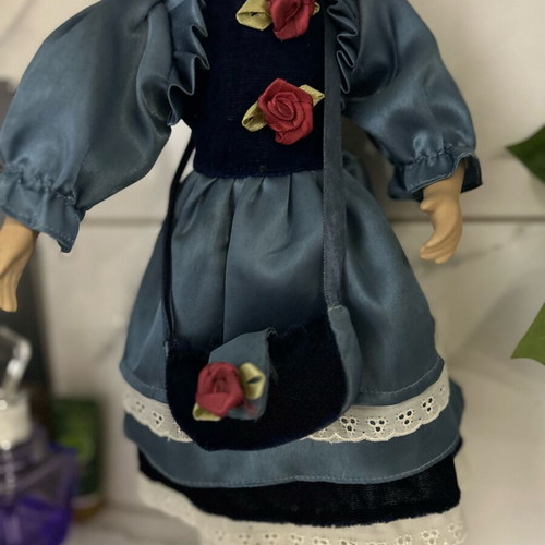 Porcelain doll like new vintage with blue satin dress