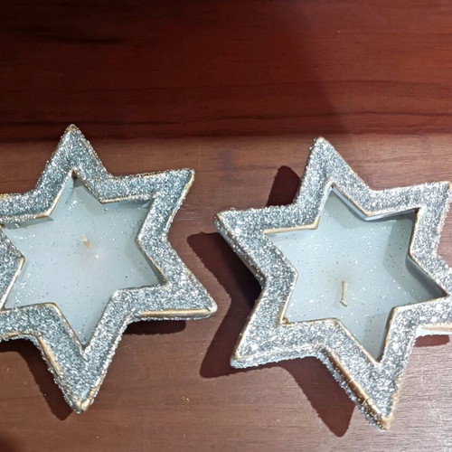 Christmas candles in clay stars with silver glitter new