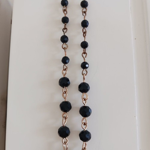 Rosary-style necklace like new with black beads and silver pendant