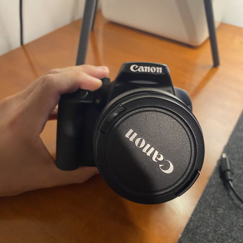 Canon EOS 1000D DSLR with EF-S 18-55mm IS lens, used