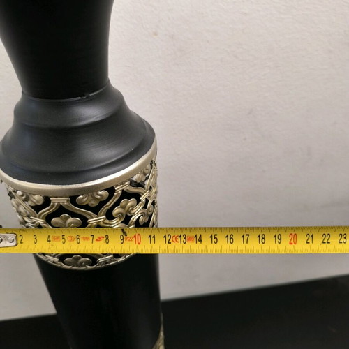 Metal vase in black color with bronze designs like new