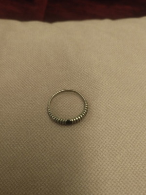 Silver ring with embossed ribbed design used