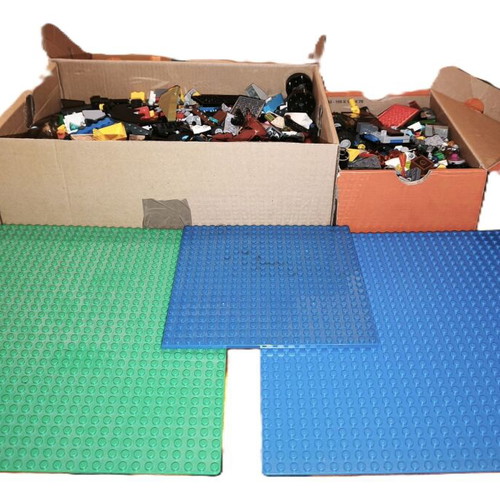 Lego boxes with pieces from various sets and 3 bases used