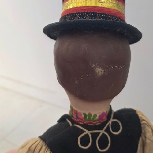 Traditional doll used with embroidered costume and hat