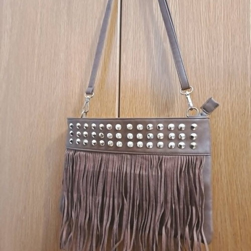 Brown synthetic suede crossbody bag with fringes and metal studs, boho style