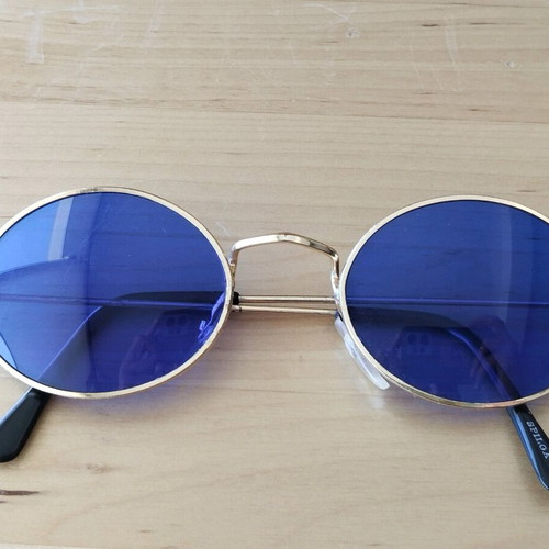 Oval sunglasses new with blue lenses and golden frames