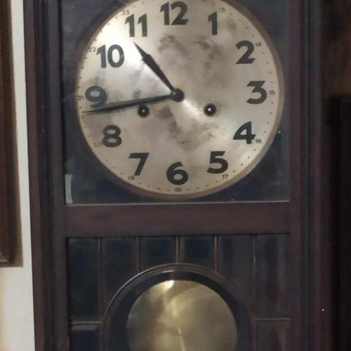 Wall clock pendulum used, wooden, old, with door and winding key