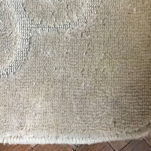 Beige rug with pattern and non-slip backing, new