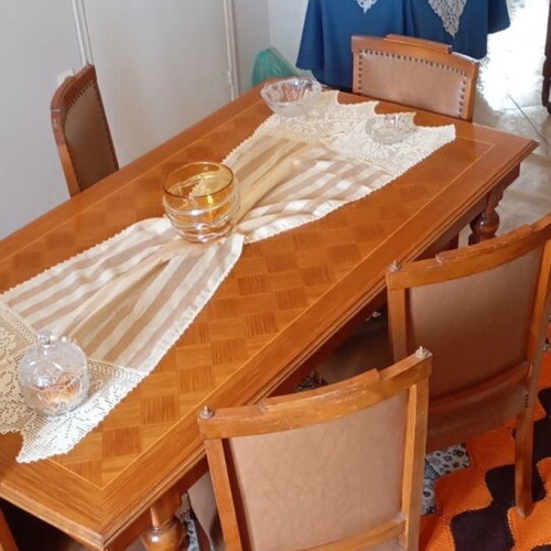 Wooden dining set used with leatherette chairs
