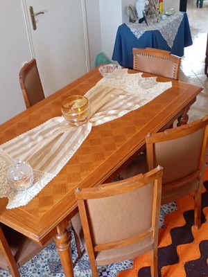 Wooden dining set used with leatherette chairs