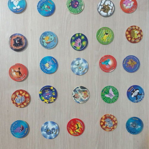 Pokemon Tazos pack of 47 and 5 gold plates like new