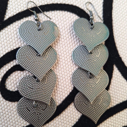 Metal heart earrings like new, gray