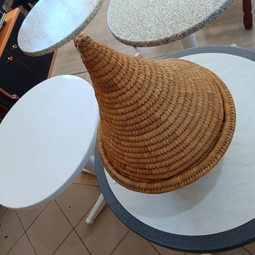 Handmade woven basket with conical lid used, natural fibers