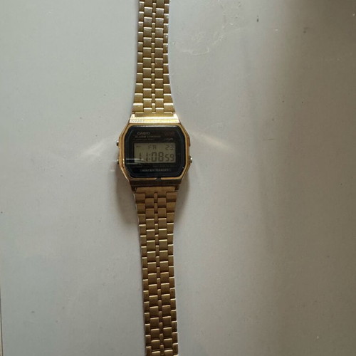 Casio digital watch used, gold color