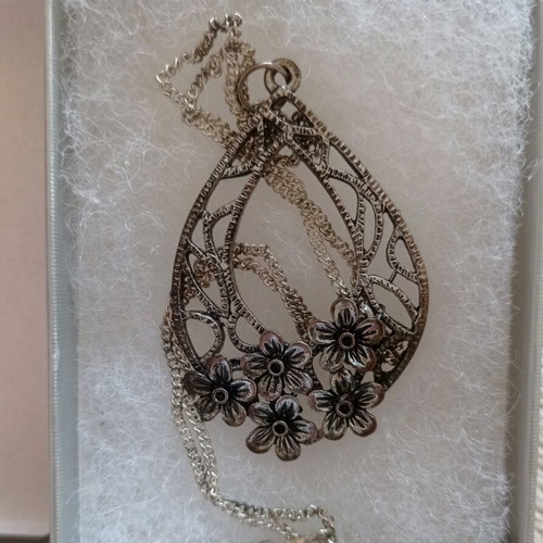 Chain with large motif used, silver with floral decoration