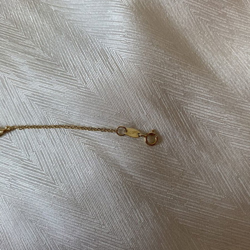 Al'Oro 9k gold bracelet with foot and eye charms