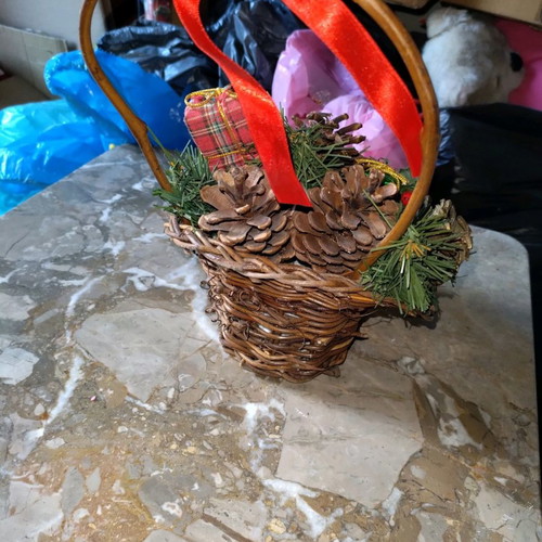 Decorated basket with pine cones new, Christmas