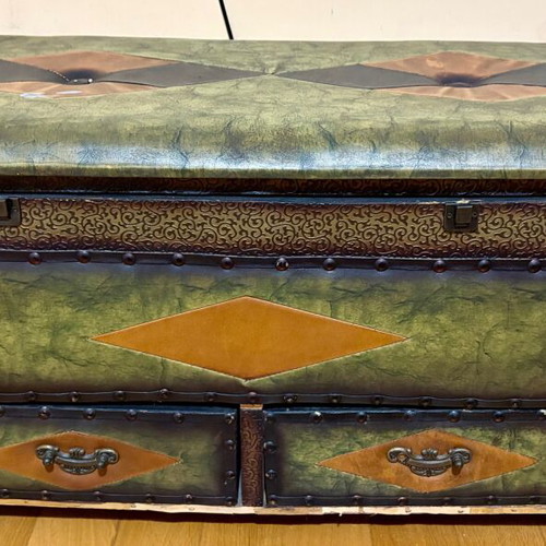 Vintage large chest with green upholstery and metal details