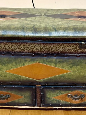 Vintage large chest with green upholstery and metal details