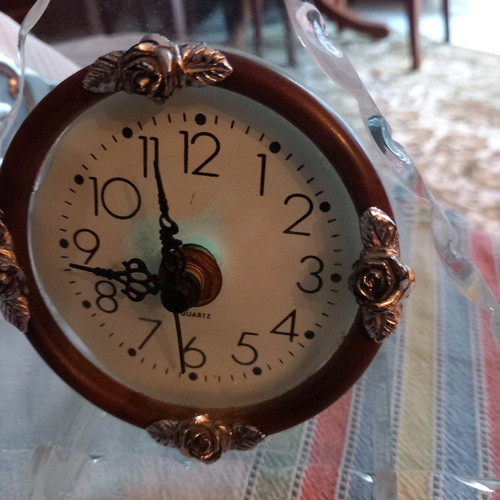 Decorative clock used, tabletop with wooden and glass base