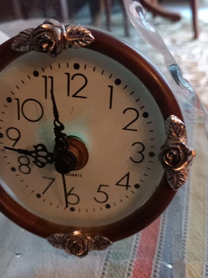 Decorative clock used, tabletop with wooden and glass base