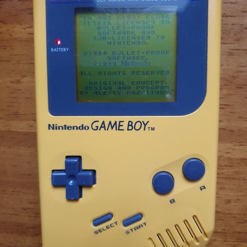 Game Boy DMG Play It Loud Edition used with Tetris cartridge
