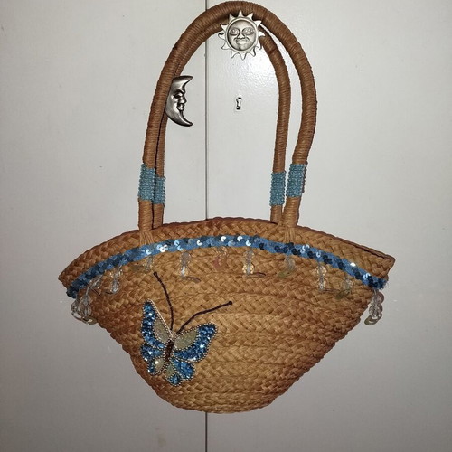Straw shoulder bag like new with light blue butterfly