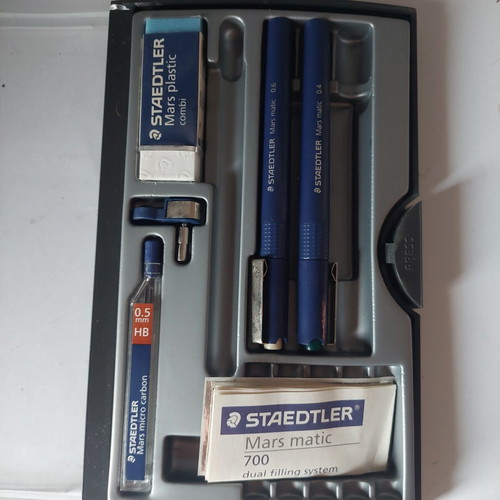 Staedtler drawing set used with rapidograph 0.4 and 0.6, eraser, compass adapter, and 0.5 leads