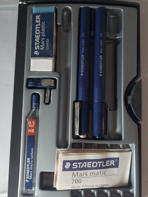 Staedtler drawing set used with rapidograph 0.4 and 0.6, eraser, compass adapter, and 0.5 leads