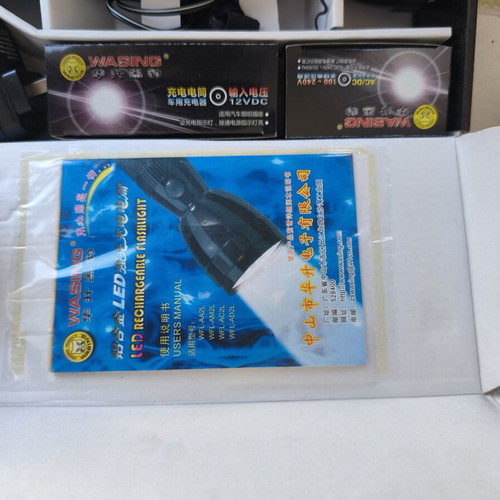 Flashlight new with rechargeable batteries and dual voltage
