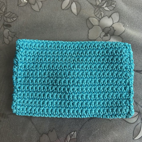 Handmade knitted clutch bag blue with button closure