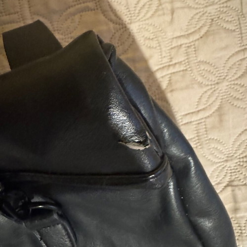 Polo backpack black used with a tear