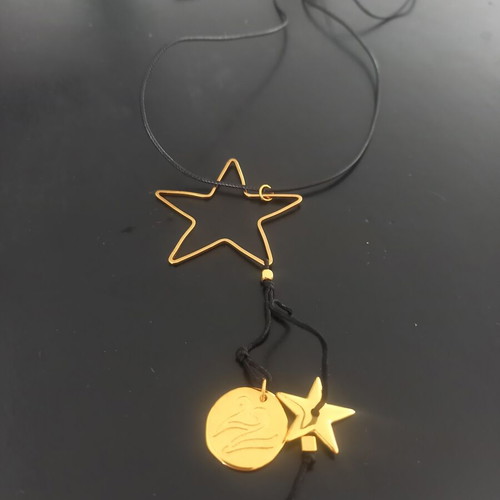 Pendant like new with subtle black and gold details