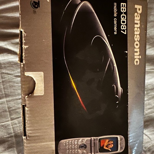 Panasonic EB-GD87 mobile phone used with box and charger needing repair